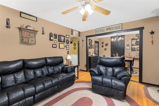 27 Nixon St, Cumberland, RI 02864 - living area with a chandelier, wood finished floors, and a ceiling fan