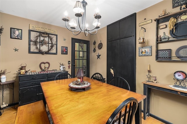 27 Nixon St, Cumberland, RI 02864 - dining area featuring a chandelier and light wood finished floors