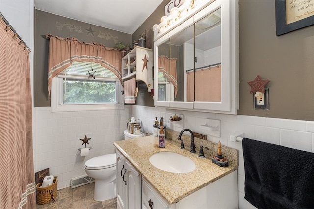 27 Nixon St, Cumberland, RI 02864 - full bath with tile walls, vanity, wainscoting, and curtained shower