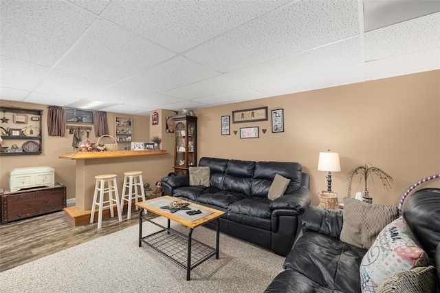 27 Nixon St, Cumberland, RI 02864 - living area featuring a drop ceiling, wood finished floors, and bar