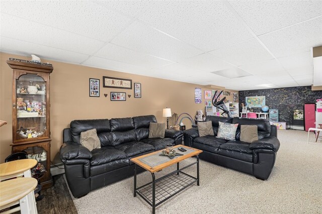 27 Nixon St, Cumberland, RI 02864 - living area with a drop ceiling, carpet flooring, and a baseboard heating unit