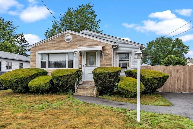 321 Beckwith St, Cranston, RI 02910 - bungalow-style house featuring stone siding and cooling unit