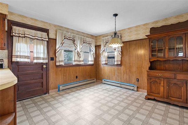 321 Beckwith St, Cranston, RI 02910 - unfurnished dining area featuring baseboard heating, light flooring, a chandelier, and wood walls