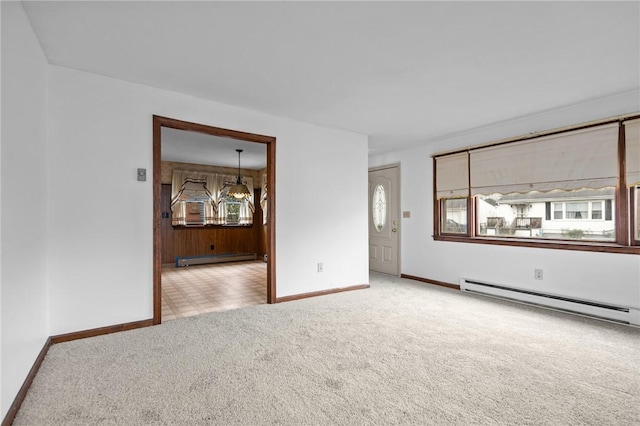 321 Beckwith St, Cranston, RI 02910 - carpeted empty room with a baseboard radiator, baseboard heating, and a chandelier