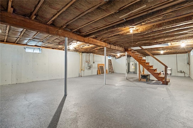 321 Beckwith St, Cranston, RI 02910 - unfinished basement featuring stairs and electric water heater