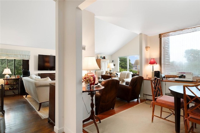668 Indian Ave, Middletown, RI 02842 - living room featuring wood finished floors, a baseboard heating unit, and vaulted ceiling