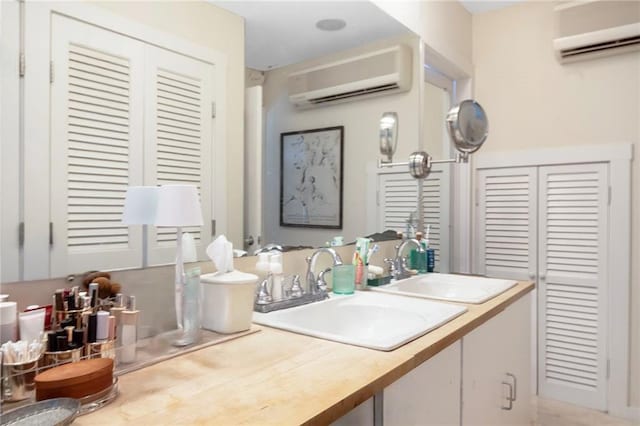 668 Indian Ave, Middletown, RI 02842 - bathroom with a wall mounted AC, a closet, and vanity