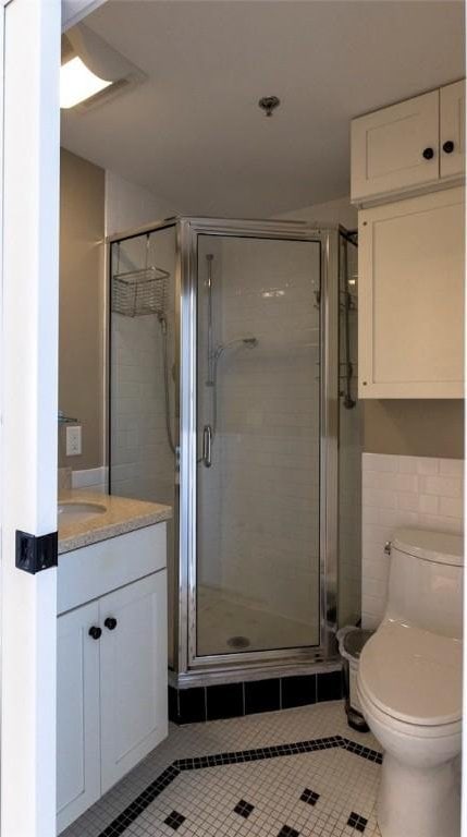 65 Weybosset St Unit 211, Providence, RI 02903 - full bathroom with tile patterned flooring, a shower stall, and vanity