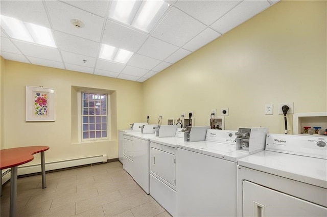 65 Weybosset St Unit 211, Providence, RI 02903 - communal laundry room featuring washing machine and clothes dryer and a baseboard heating unit
