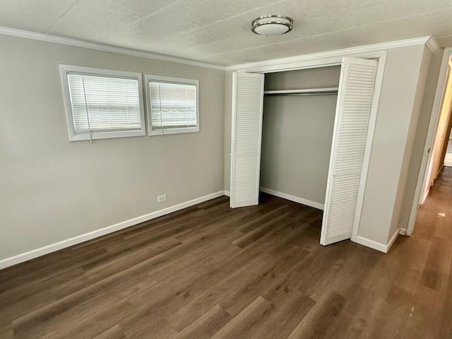4 Lane B Ln, Coventry, RI 02816 - unfurnished bedroom featuring ornamental molding, a closet, and dark wood-type flooring