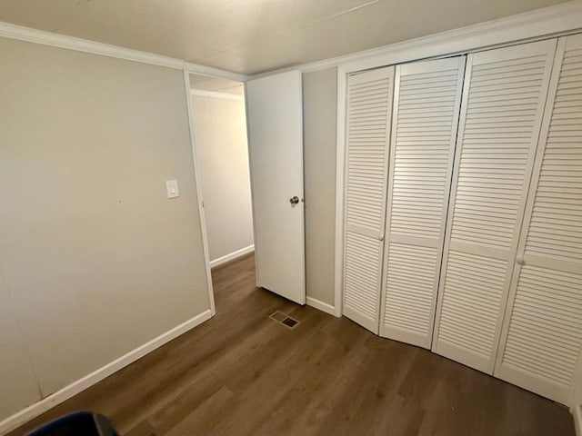 4 Lane B Ln, Coventry, RI 02816 - unfurnished bedroom with dark wood-style flooring, a closet, and ornamental molding