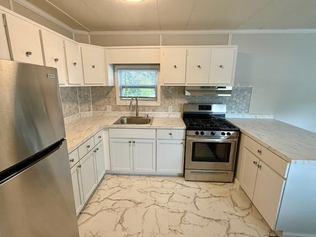 4 Lane B Ln, Coventry, RI 02816 - kitchen with appliances with stainless steel finishes, under cabinet range hood, ornamental molding, a peninsula, and backsplash