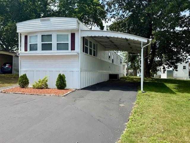 4 Lane B Ln, Coventry, RI 02816 - view of front facade with driveway, a front yard, and an attached carport