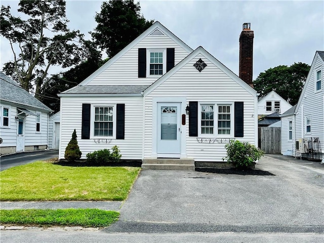 74 Leslie St, Cranston, RI 02910 - bungalow-style home with a chimney