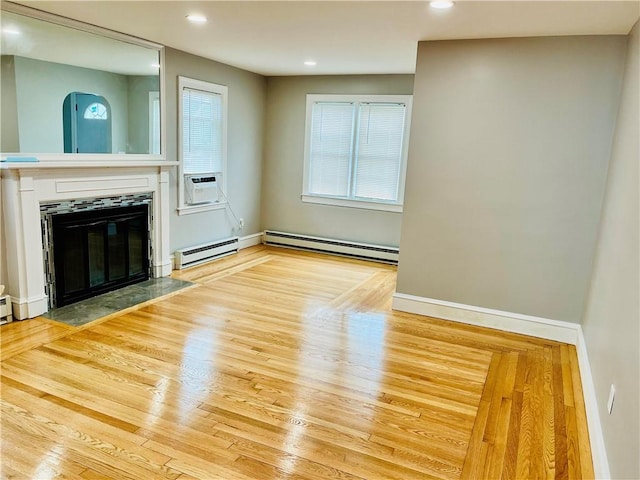 74 Leslie St, Cranston, RI 02910 - unfurnished living room with a baseboard radiator, baseboard heating, wood finished floors, and recessed lighting