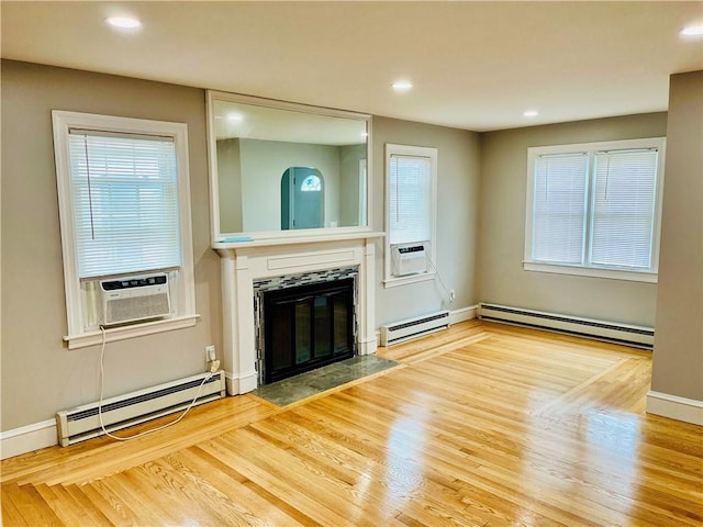 74 Leslie St, Cranston, RI 02910 - unfurnished living room with a baseboard radiator, baseboard heating, cooling unit, a high end fireplace, and recessed lighting