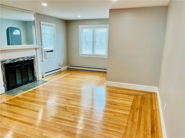 74 Leslie St, Cranston, RI 02910 - unfurnished living room featuring a baseboard radiator, a fireplace with flush hearth, wood finished floors, recessed lighting, and cooling unit