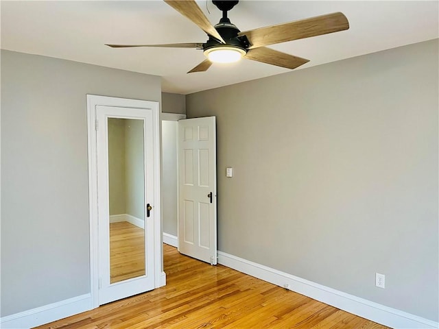 74 Leslie St, Cranston, RI 02910 - empty room with ceiling fan and light wood finished floors
