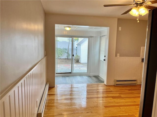 74 Leslie St, Cranston, RI 02910 - corridor featuring a baseboard radiator and wood finished floors