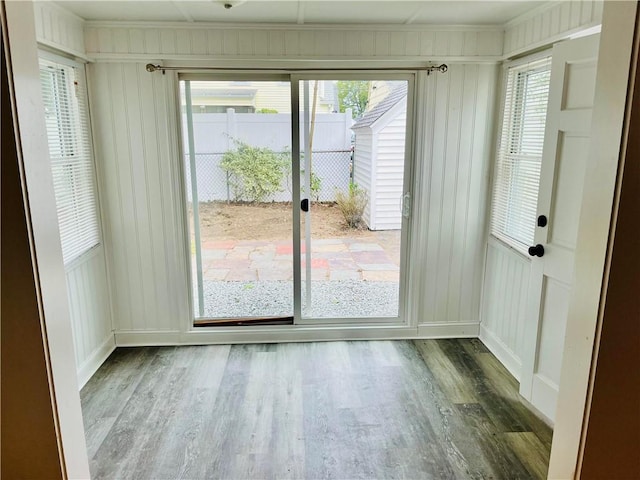 74 Leslie St, Cranston, RI 02910 - doorway to outside featuring a decorative wall, wood finished floors, and ornamental molding