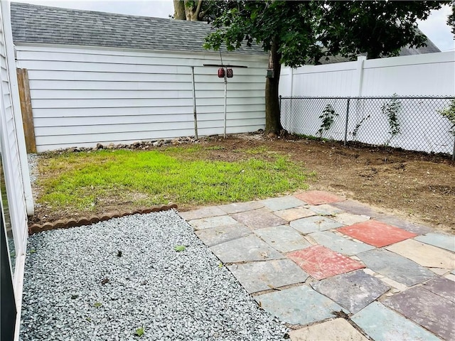 74 Leslie St, Cranston, RI 02910 - fenced backyard with a patio area