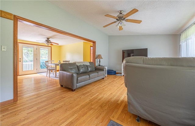 1846 E Wallum Lake Rd, Burrillville, RI 02859 - living room featuring light wood finished floors, ceiling fan, plenty of natural light, and a textured ceiling