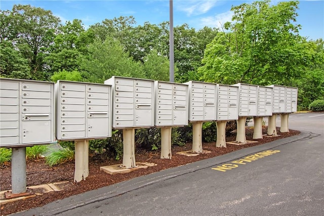 120 Mill St Unit 103, Woonsocket, RI 02895 - view of community with mail area and view of scattered trees