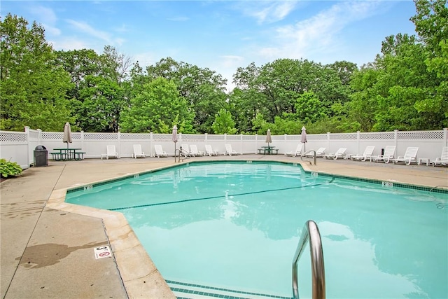 120 Mill St Unit 103, Woonsocket, RI 02895 - community pool featuring a patio and view of wooded area