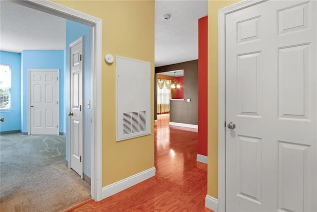 120 Mill St Unit 103, Woonsocket, RI 02895 - corridor with wood finished floors and a chandelier