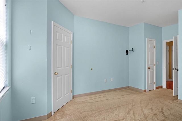 120 Mill St Unit 103, Woonsocket, RI 02895 - unfurnished bedroom with carpet and baseboards