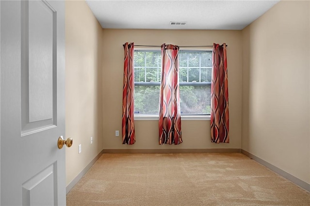 120 Mill St Unit 103, Woonsocket, RI 02895 - carpeted empty room featuring baseboards
