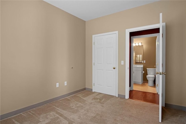 120 Mill St Unit 103, Woonsocket, RI 02895 - unfurnished bedroom featuring carpet floors and connected bathroom