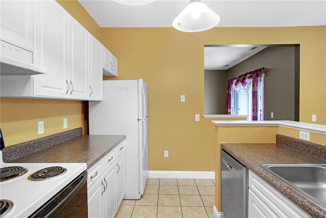 120 Mill St Unit 103, Woonsocket, RI 02895 - kitchen with white appliances, white cabinetry, light tile patterned floors, and dark countertops
