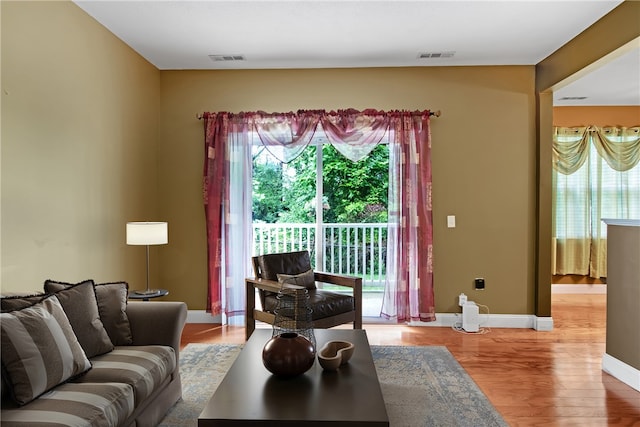 120 Mill St Unit 103, Woonsocket, RI 02895 - living room featuring wood finished floors and baseboards