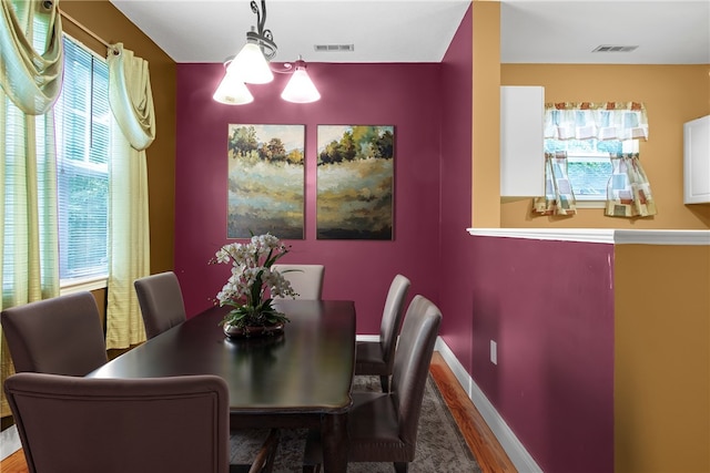 120 Mill St Unit 103, Woonsocket, RI 02895 - dining room featuring wood finished floors and baseboards