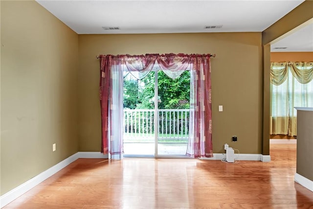 120 Mill St Unit 103, Woonsocket, RI 02895 - unfurnished room with light wood-type flooring and baseboards