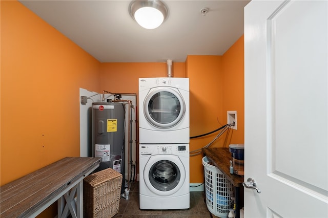 333 Atwells Ave Unit 302, Providence, RI 02903 - washroom with electric water heater, stacked washer and clothes dryer, and tile patterned floors