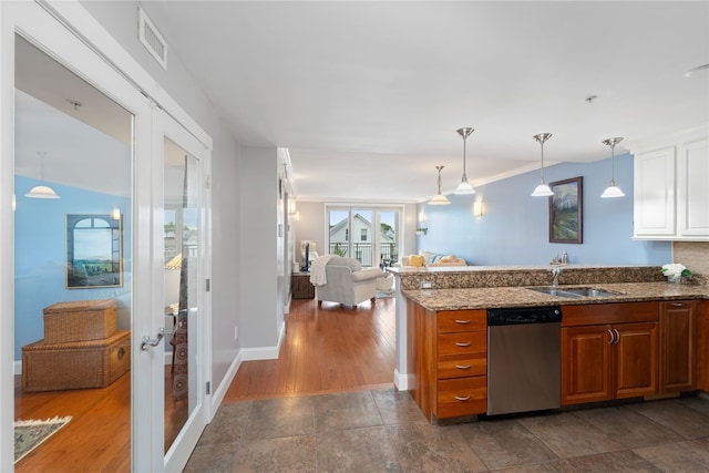 333 Atwells Ave Unit 302, Providence, RI 02903 - kitchen featuring dishwasher, stone countertops, open floor plan, a peninsula, and white cabinets