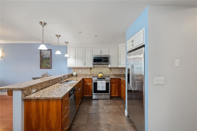 333 Atwells Ave Unit 302, Providence, RI 02903 - kitchen with stainless steel appliances, tasteful backsplash, a peninsula, brown cabinets, and light stone counters