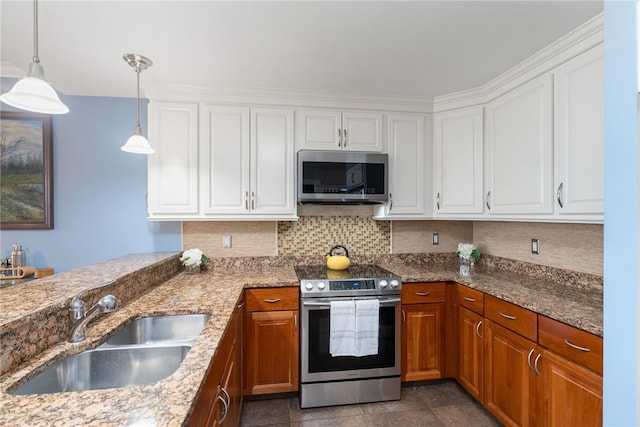 333 Atwells Ave Unit 302, Providence, RI 02903 - kitchen with appliances with stainless steel finishes, white cabinets, and brown cabinets
