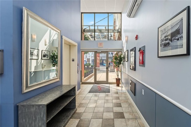 333 Atwells Ave Unit 302, Providence, RI 02903 - tiled entrance foyer with an AC wall unit, a high ceiling, and french doors