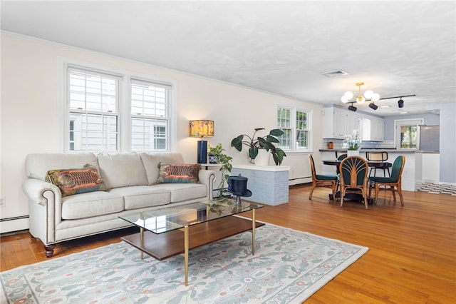 112 Edgewood Blvd, Providence, RI 02905 - living area featuring a chandelier, healthy amount of natural light, and light wood-style flooring