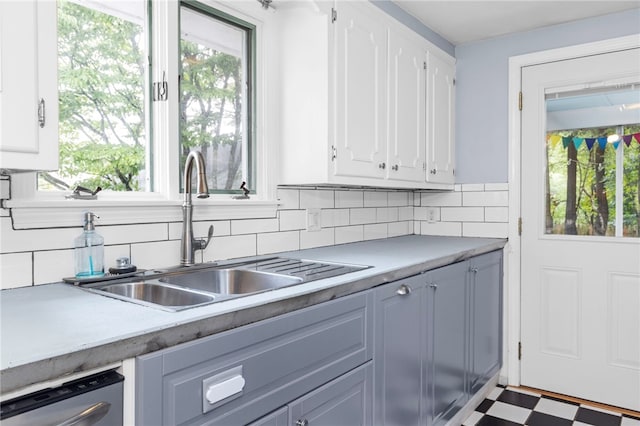 112 Edgewood Blvd, Providence, RI 02905 - kitchen with white cabinetry, tasteful backsplash, light countertops, and tile patterned floors