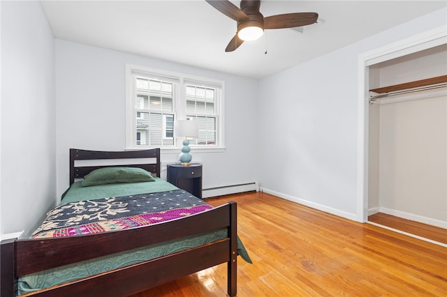 112 Edgewood Blvd, Providence, RI 02905 - bedroom with a baseboard radiator, wood finished floors, and ceiling fan