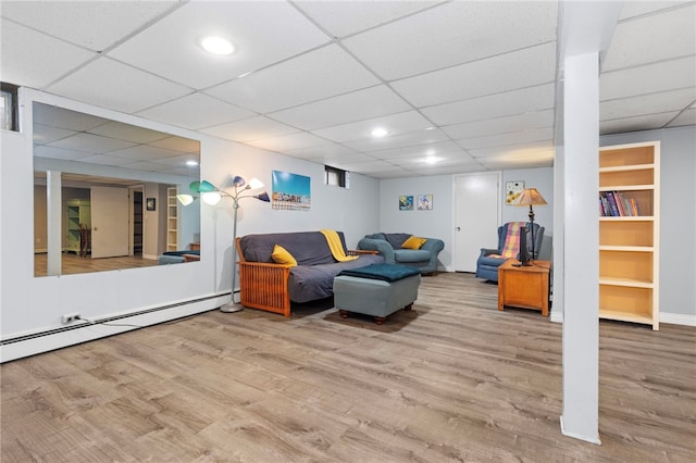112 Edgewood Blvd, Providence, RI 02905 - living area with a baseboard heating unit, wood finished floors, a paneled ceiling, and recessed lighting