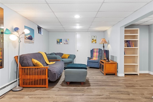 112 Edgewood Blvd, Providence, RI 02905 - living room with a baseboard heating unit, wood finished floors, a paneled ceiling, and built in features