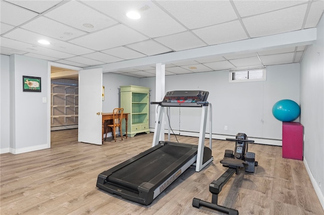 112 Edgewood Blvd, Providence, RI 02905 - workout area featuring baseboard heating, a drop ceiling, and wood finished floors