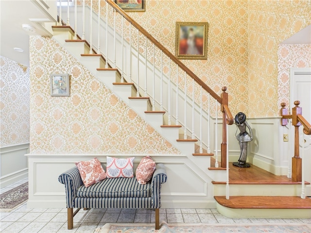 150 Central Ave, Johnston, RI 02919 - stairs featuring wallpapered walls, tile patterned floors, a wainscoted wall, and a decorative wall