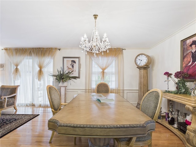 150 Central Ave, Johnston, RI 02919 - dining room featuring a chandelier, plenty of natural light, crown molding, wood finished floors, and wainscoting