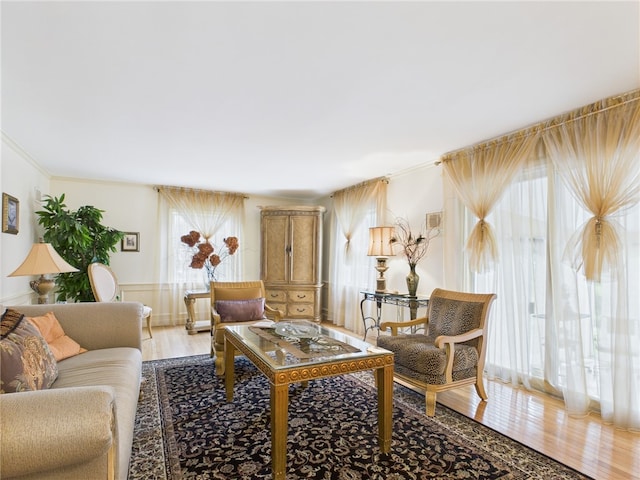 150 Central Ave, Johnston, RI 02919 - living area featuring light wood-style floors, ornamental molding, and wainscoting
